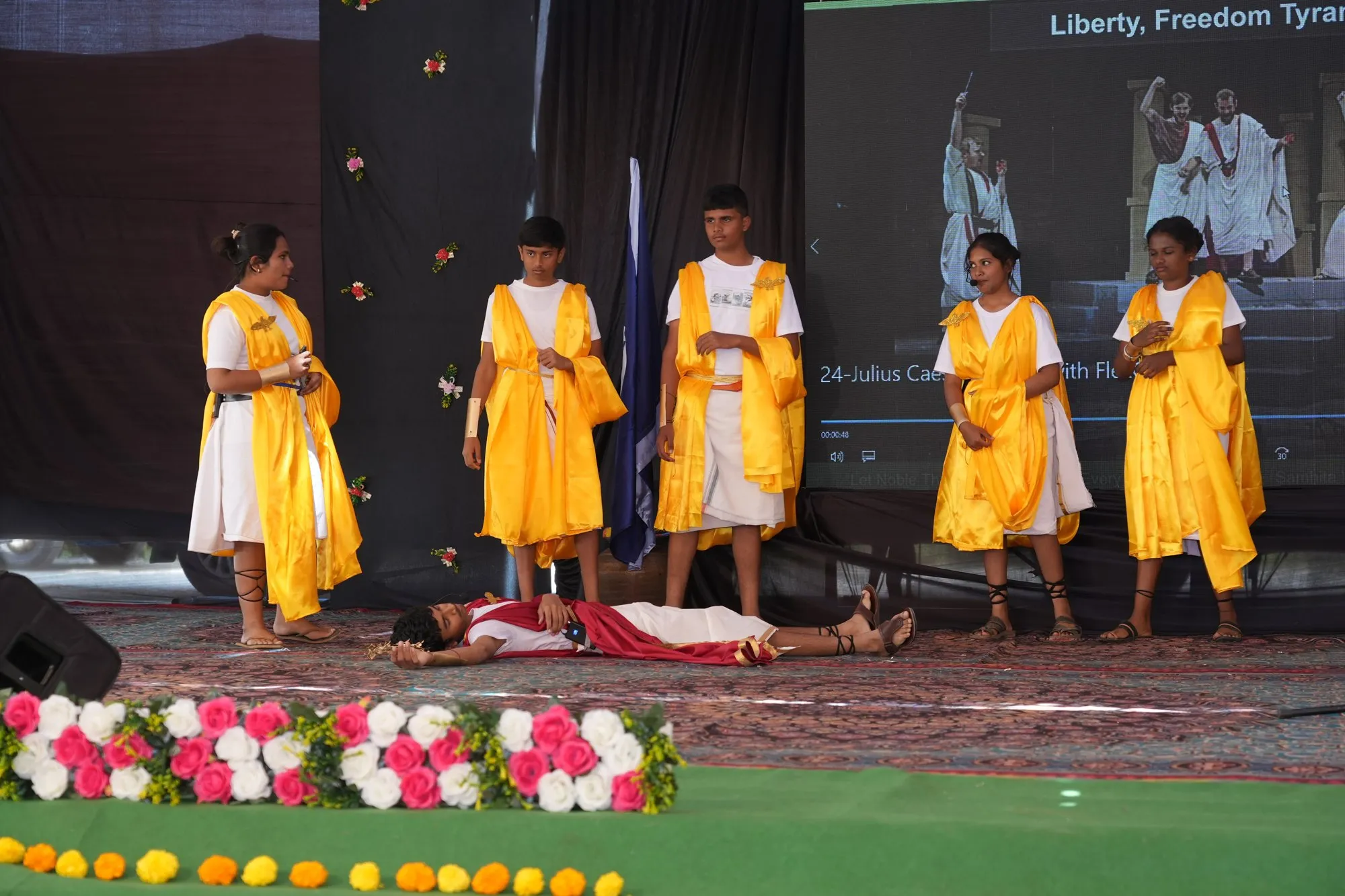 High-school students performing Julius Caesar on the school stage