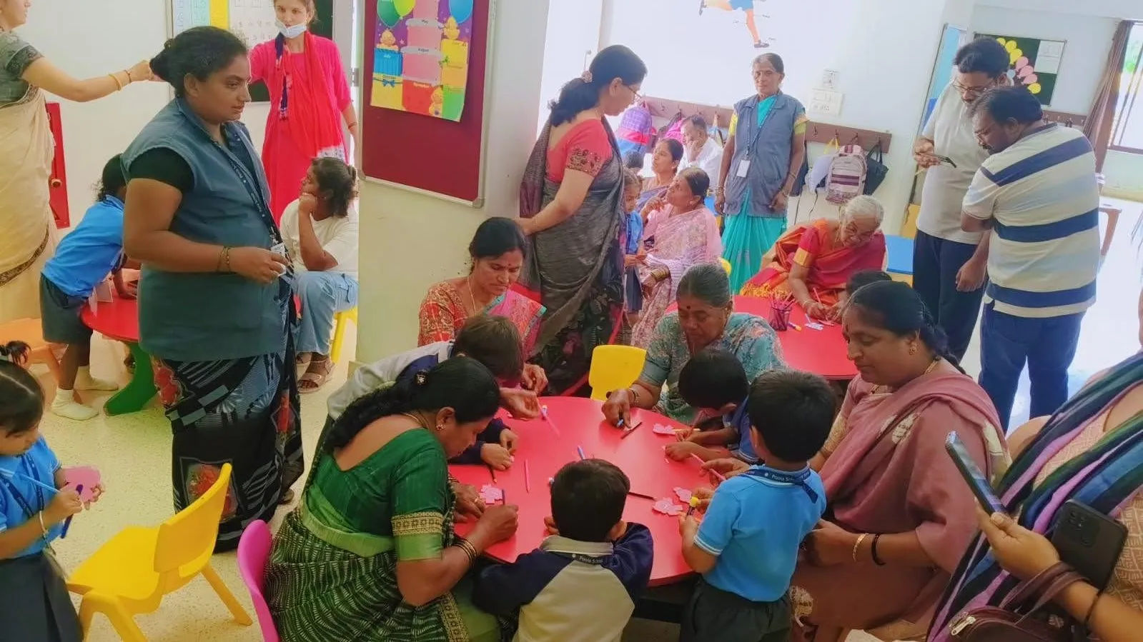 Grandparents and children together at a classroom celebration