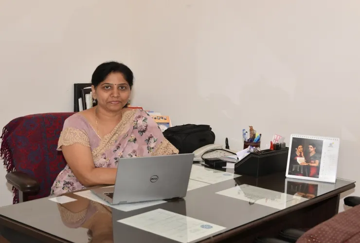 Principal Banurekha P A at her desk