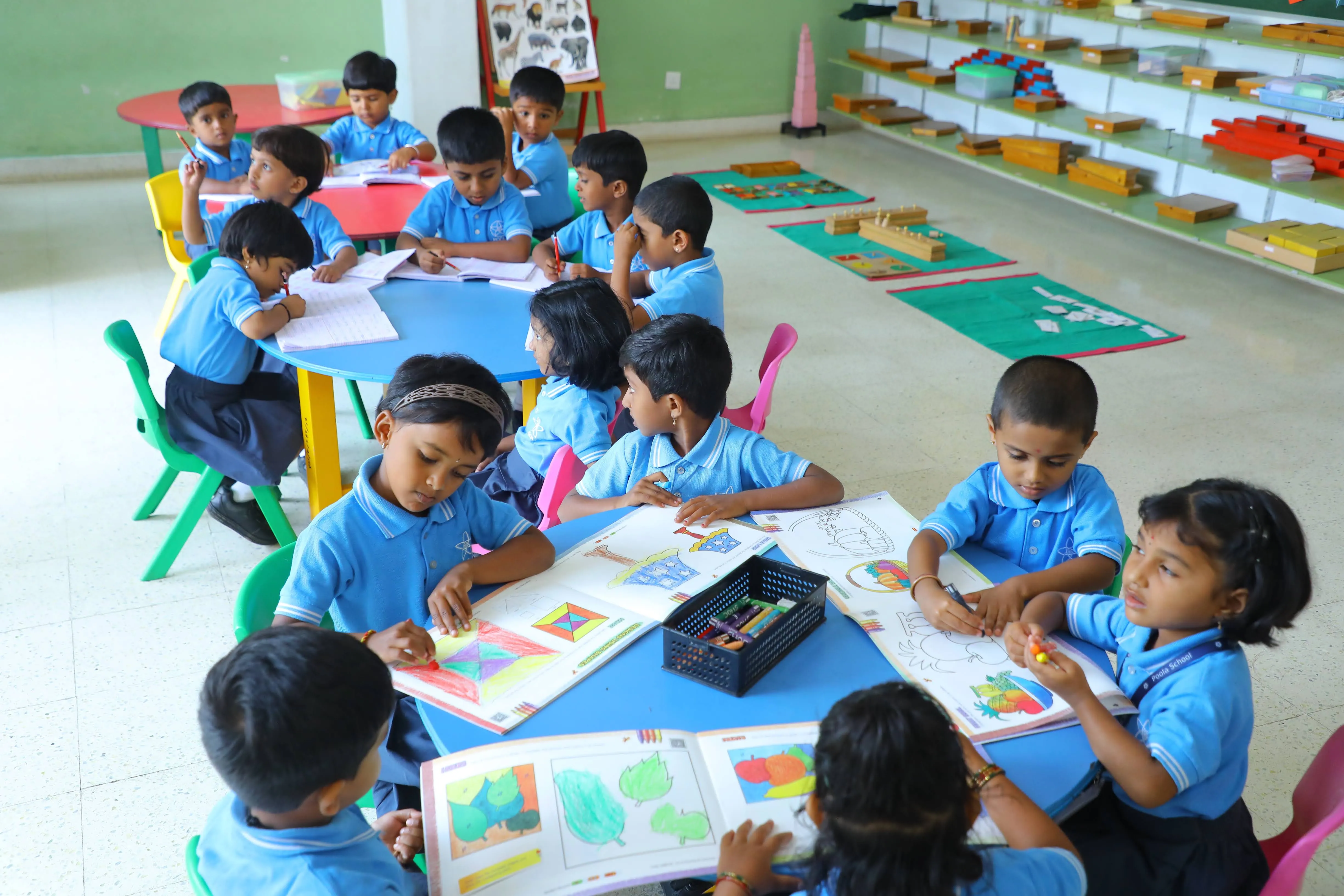 Children working together at a shared classroom table
