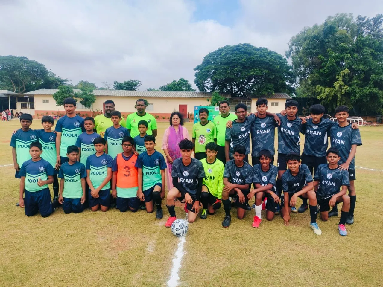 The Poola School soccer team in their blue and teal kit